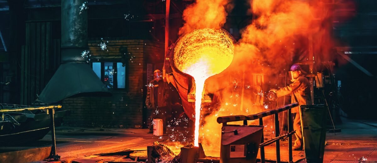 Liquid iron molten metal being poured.