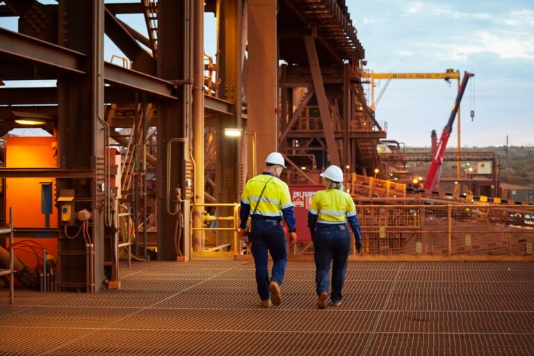 Two FMG workers at the Cloudbreak Mine.