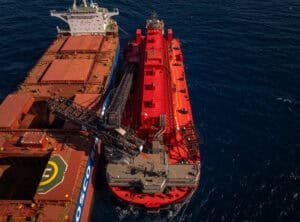 (Image source: Mineral Resources) MinRes transhipper loading Onslow iron’s first ore to a COSCO Shipping bulk carrier. 