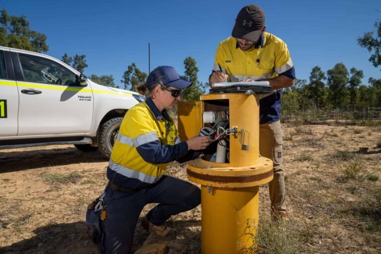 Environmental scientists undertaking groundwater sampling from a borehole near the Carmichael mine.