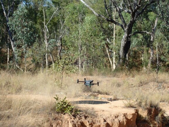 (Image source: Bravus Mining and Resources) A drone taking flight within the study area.