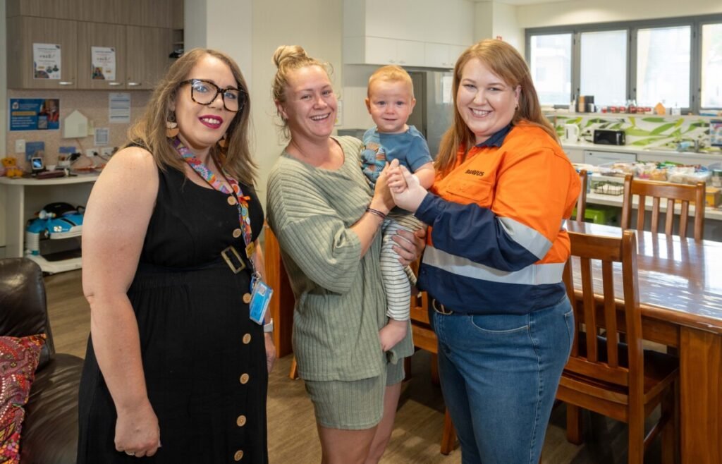 Ms Brown joins Ronald McDonald House Charities community engagement executive Narrisha McDougal (L), along with Shannara and Lucah, at the Ronald McDonald House Townsville Family Room.