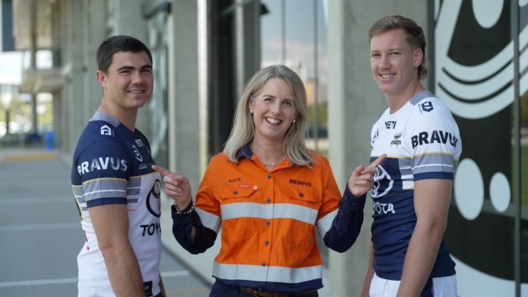 (Image source: BRAVUS) North Queensland Toyota Cowboys players Jaxon Purdue and Jake Clifford with Bravus Head of Reputation Kate Campbell.